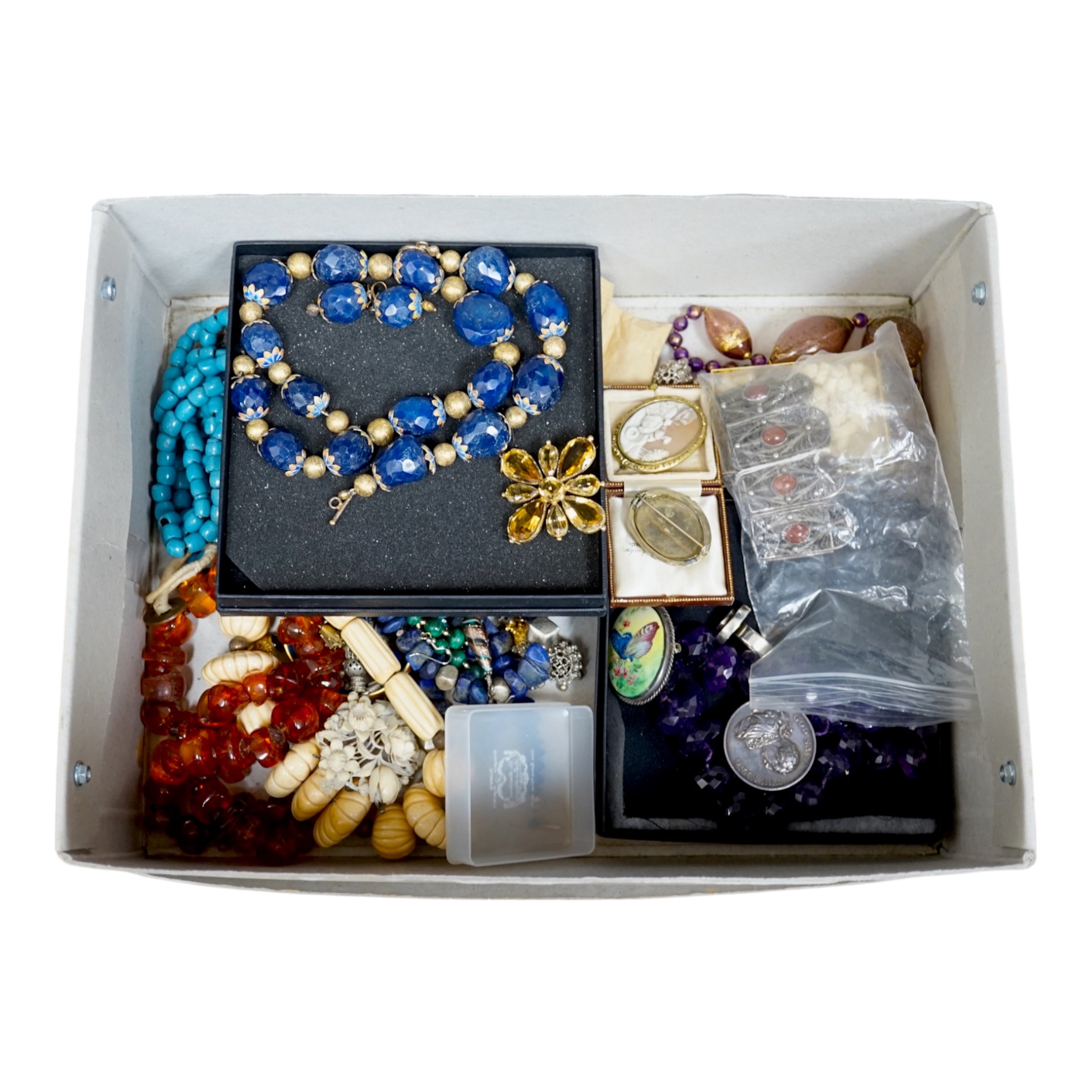 A quantity of of assorted mainly costume jewellery, including a facetted amethyst bead necklace, Grand National Jubilee medallion yellow metal and citrine cluster set pendant, glass necklace etc. Condition - poor to fair